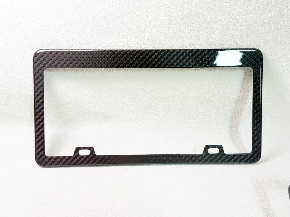 Carbon Fiber License Plate Frame – Wide Top | Maximum Visibility — carbon fiber close-up view 1