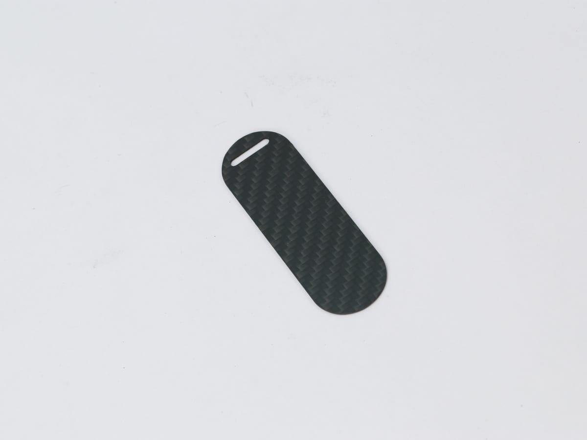 Capsule Hang Tag – Carbon Fiber | Modern Design — carbon fiber close-up view 3