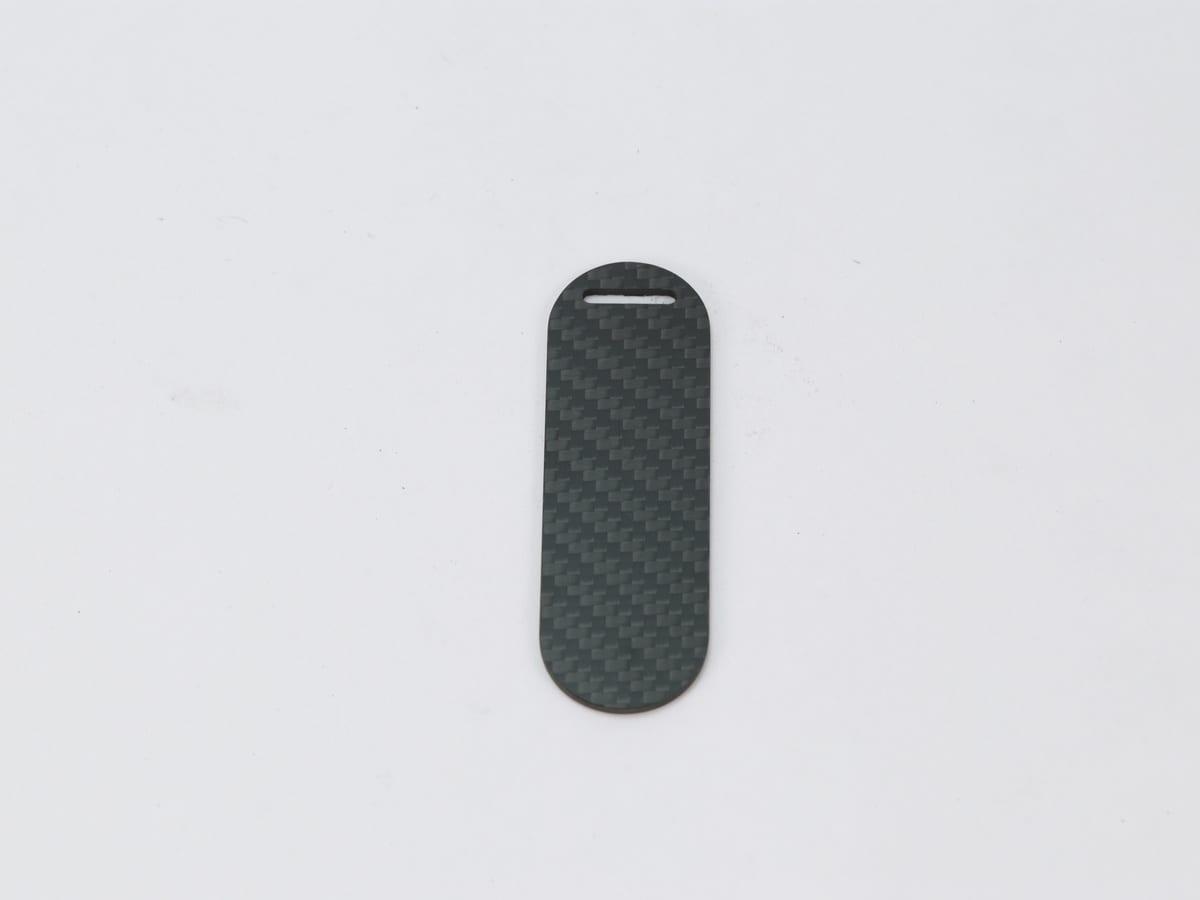 Capsule Hang Tag – Carbon Fiber | Modern Design — carbon fiber close-up view 4