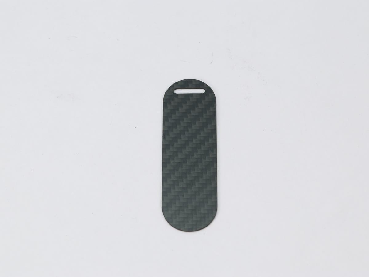 Capsule Hang Tag – Carbon Fiber | Modern Design — carbon fiber close-up view 1