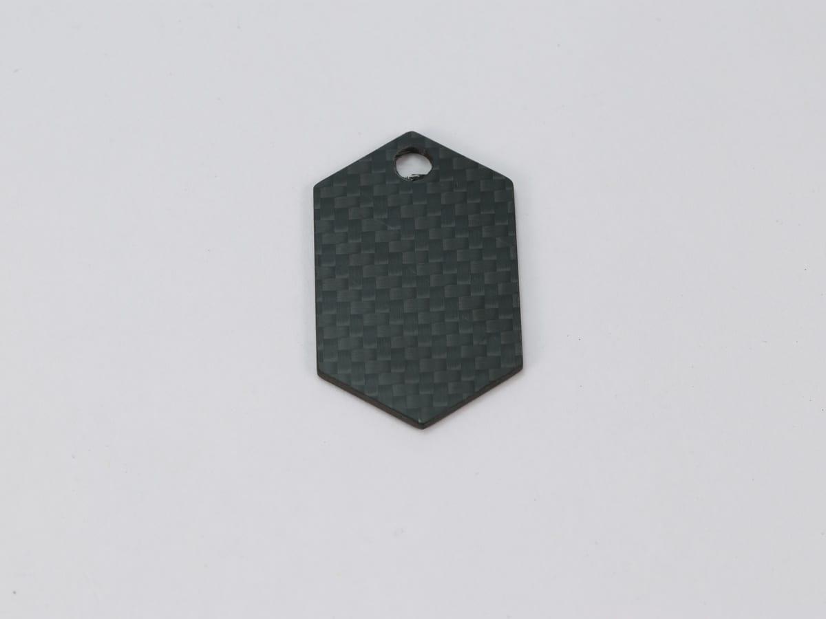 Cross Tag – Carbon Fiber | Symbolic Design — carbon fiber close-up view 1