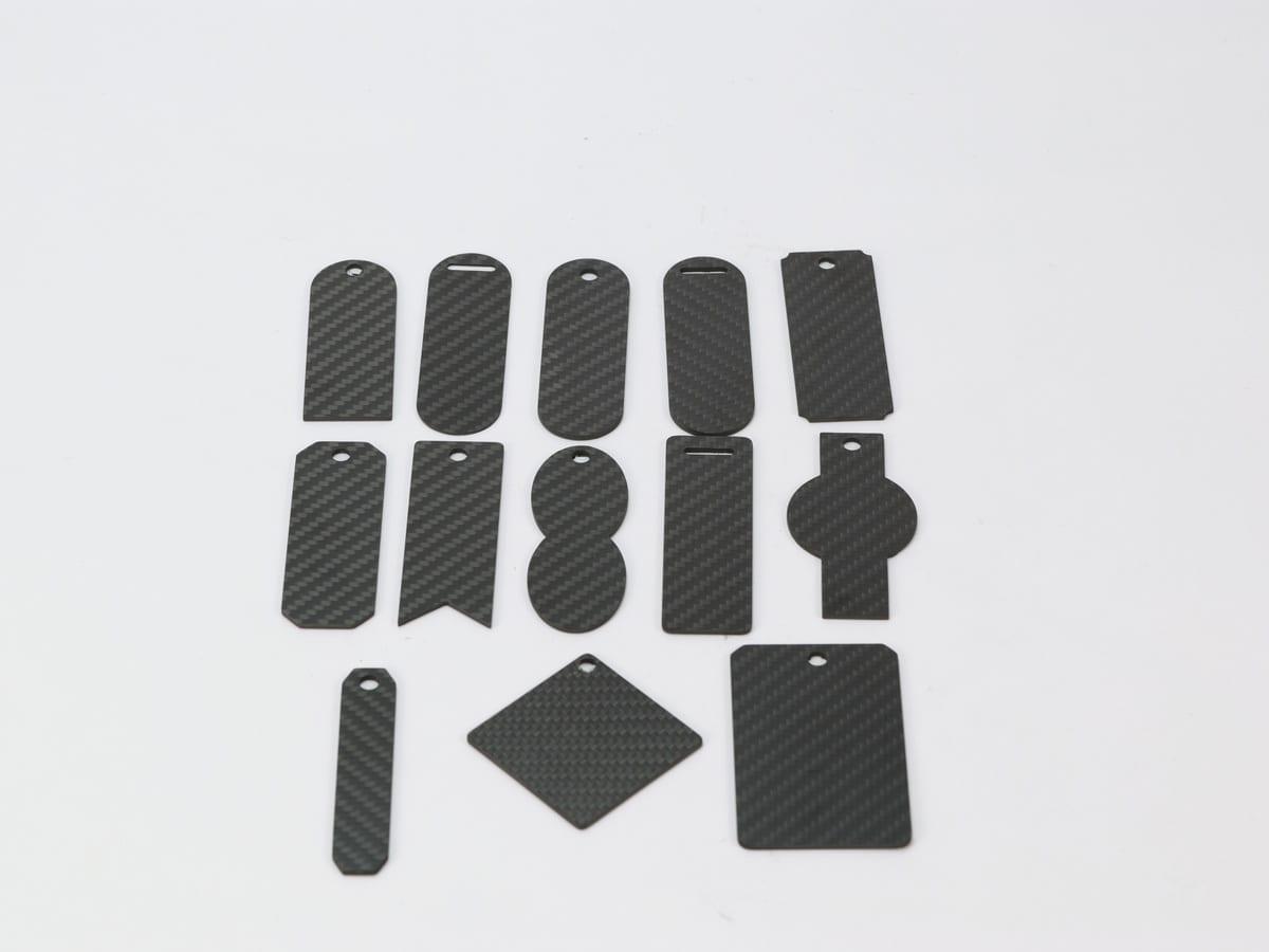 Custom Shape Tag – Carbon Fiber | Your Design, Your Shape — carbon fiber close-up view 1