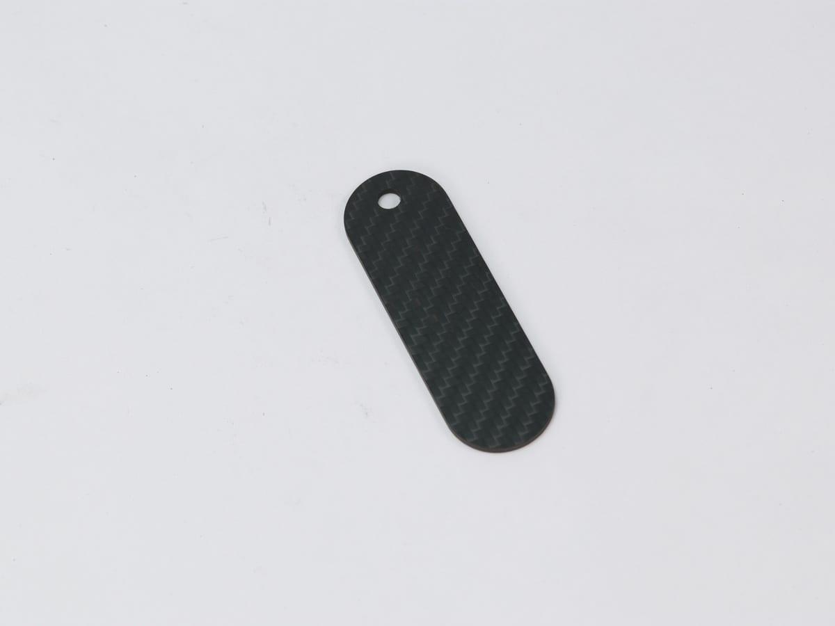 Oval Hang Tag – Carbon Fiber | Classic Elegance — carbon fiber close-up view 2
