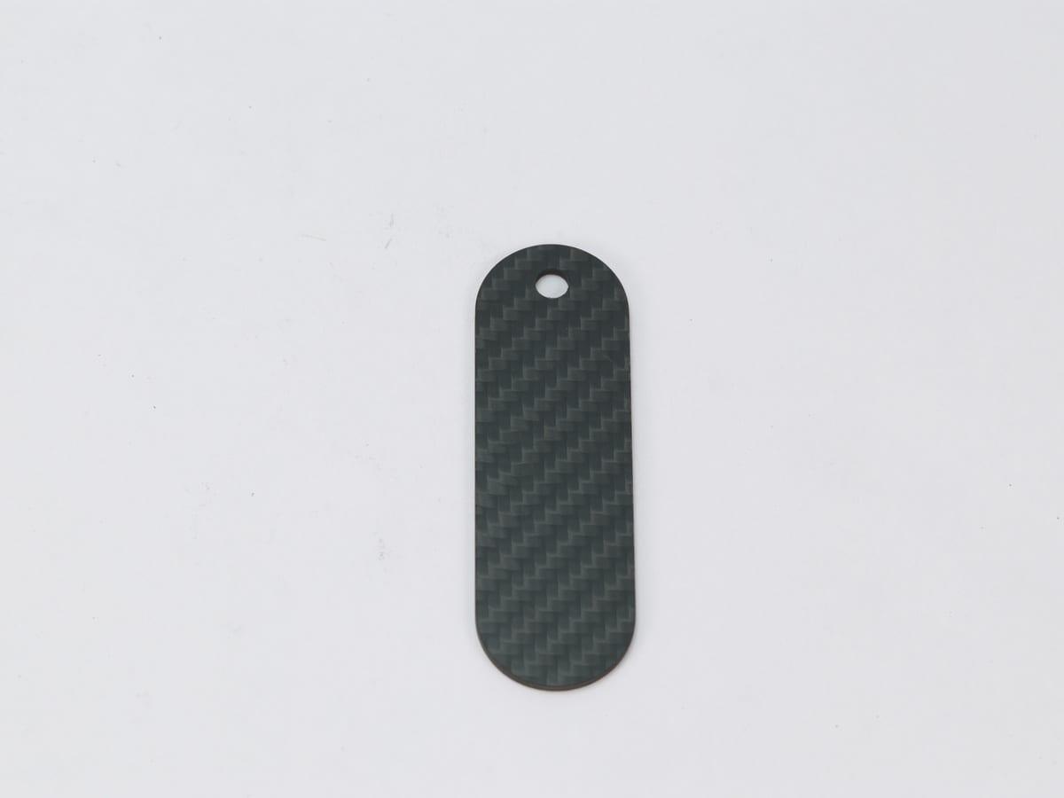 Oval Hang Tag – Carbon Fiber | Classic Elegance — carbon fiber close-up view 1