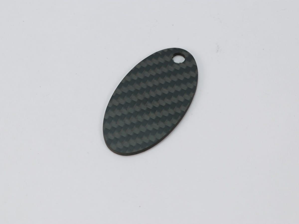 Shield Hang Tag – Carbon Fiber | Bold Statement — carbon fiber close-up view 3