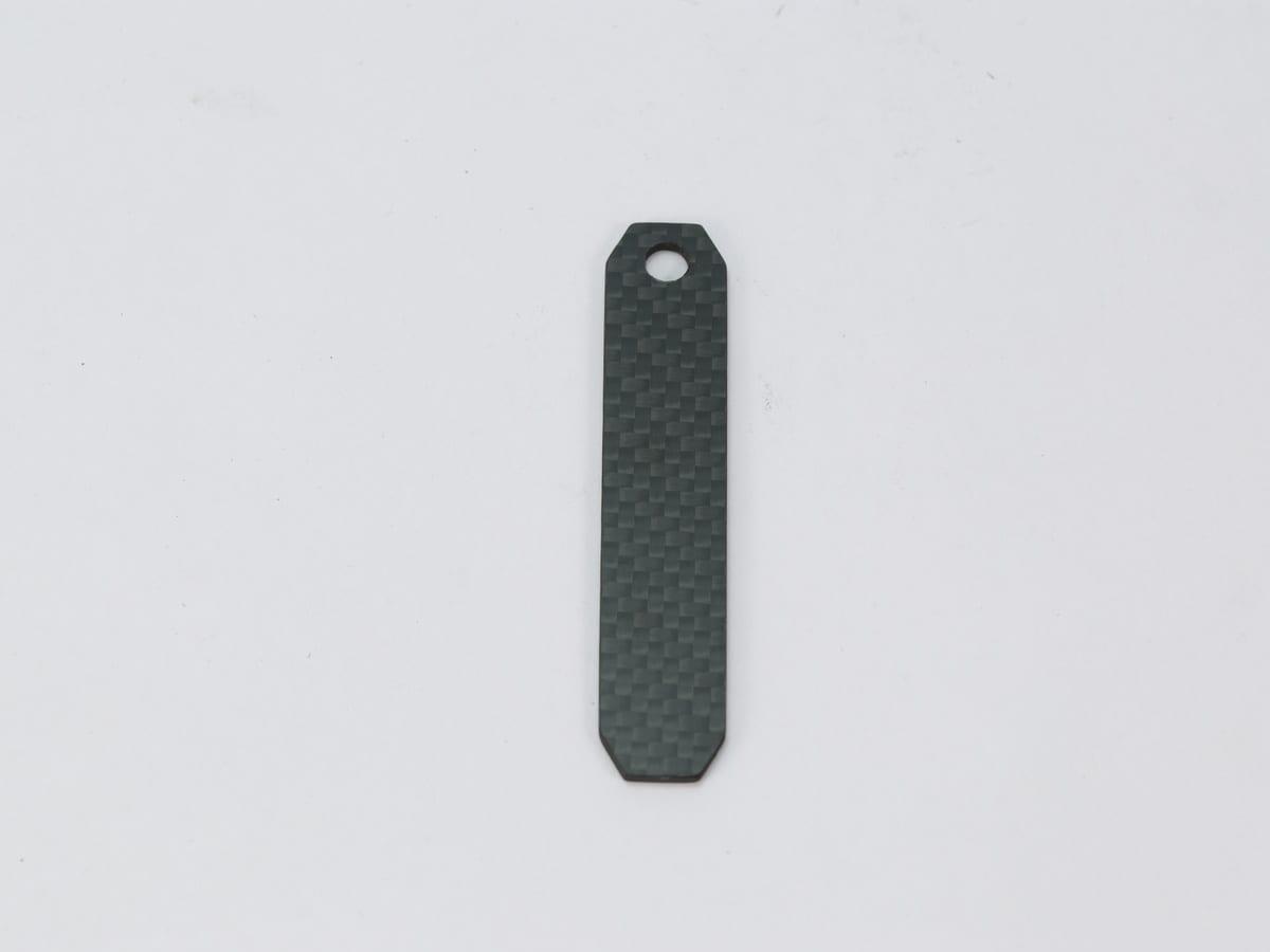 Slim Bar Tag – Carbon Fiber | Sleek Profile — carbon fiber close-up view 1