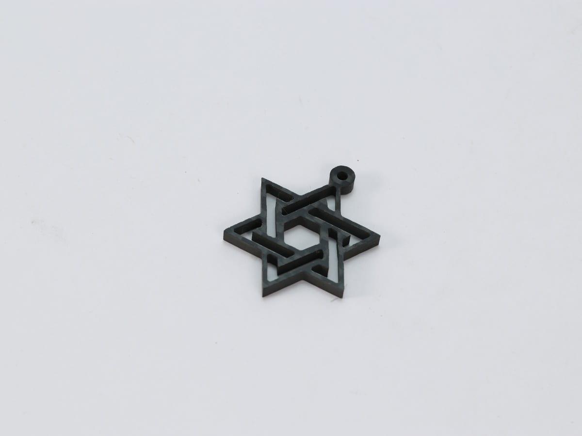 Carbon Fiber Cross Pendant – Ultra-Light 5g | Stainless Steel Bail — carbon fiber close-up view 3