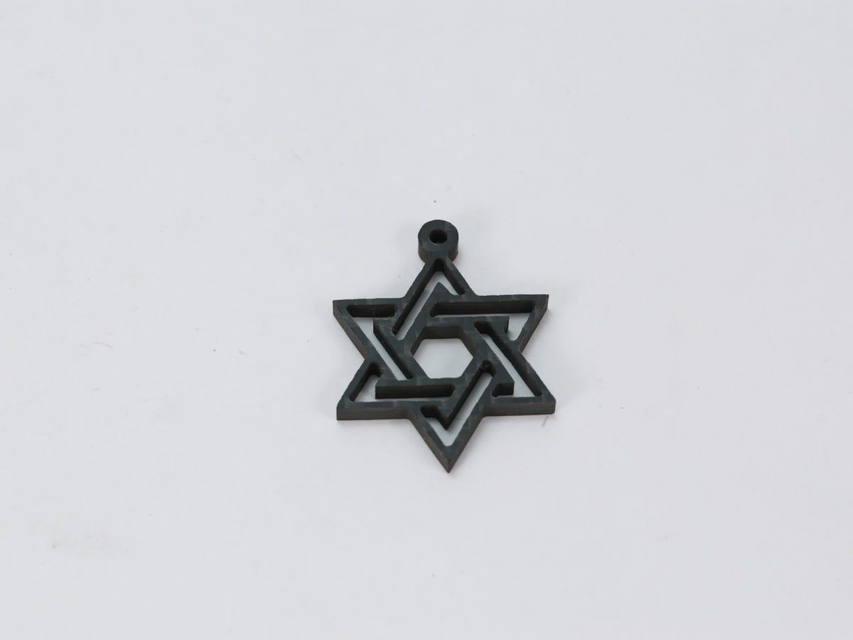Carbon Fiber Cross Pendant – Ultra-Light 5g | Stainless Steel Bail — carbon fiber close-up view 1